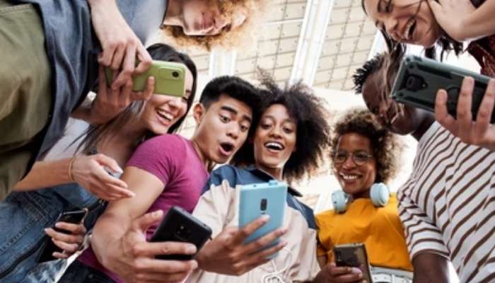 An undated image of a group of people usingt their smartphones. — Shutterstock
