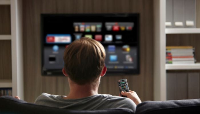 An undated image of a person watching TV. — Canva