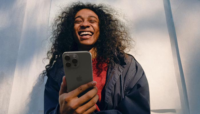 An undated image of person using iPhone 16 Pro Max. — Apple