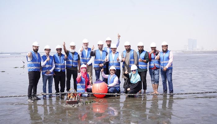 An undated image of Africa-1 submarine cable and PTCL employees. — Supplied