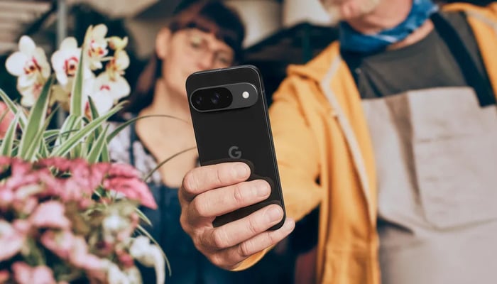 An undated image of a person using a Pixel 9 phone. — Google Keyword