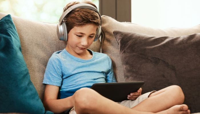 An undated image of a boy using tablet. — Canva