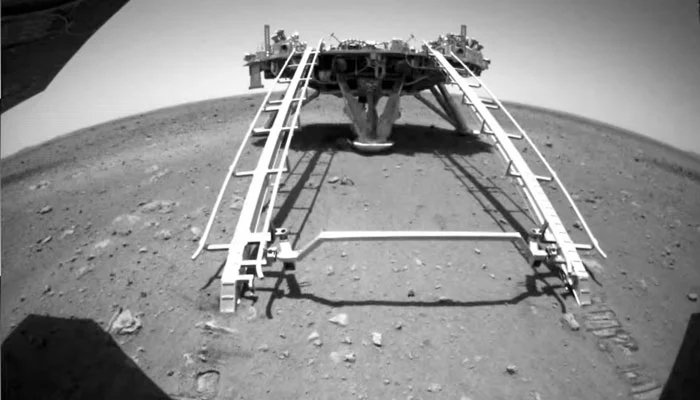 Chinese rover Zhurong of the Tianwen-1 mission drives down the ramp of the lander onto the surface of Mars, in this screenshot taken from a video released by China National Space Administration (CNSA) May 22, 2021. — Reuters