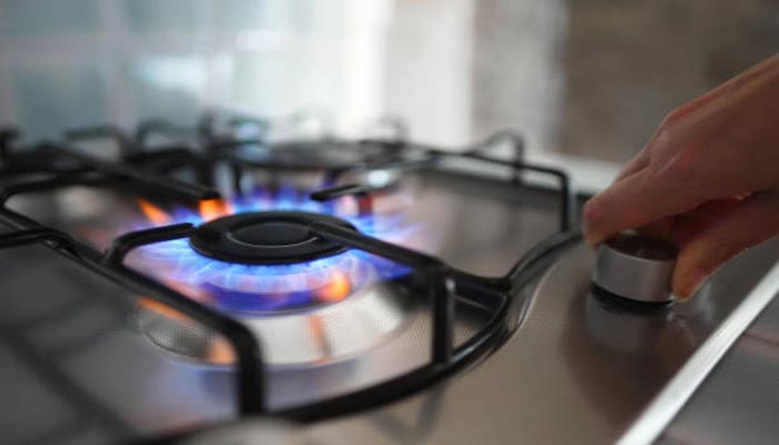 An undated image of person using gas stove. — iStock