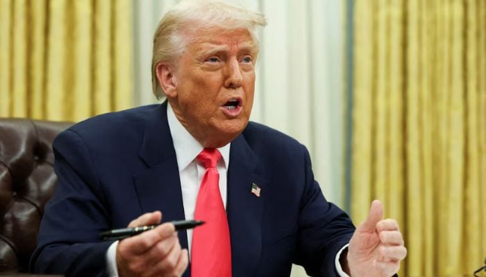 US President Donald Trump signing executive orders in the Oval Office, White House, March 6, 2025. — Reuters