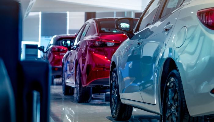 An undated image of cars in a showroom. — Canva