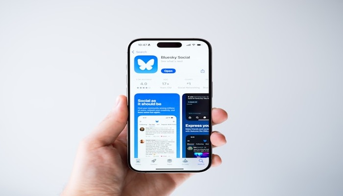 An undated image of a person using Bluesky app. — Unsplash