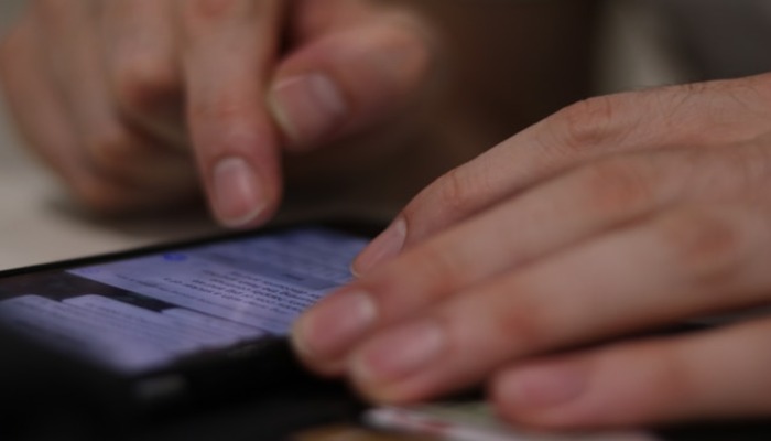 An undated image of a person using WhatsApp chats. —  Unsplash