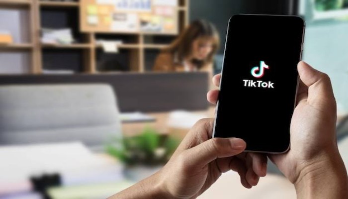 An undated image of a person using TikTok. — Freepik