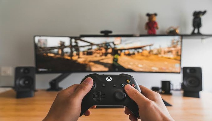 An undated image of a person playing Xbox games.— Unsplash
