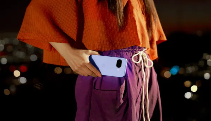 An undated image of a person with Google Pixel phones. — Google
