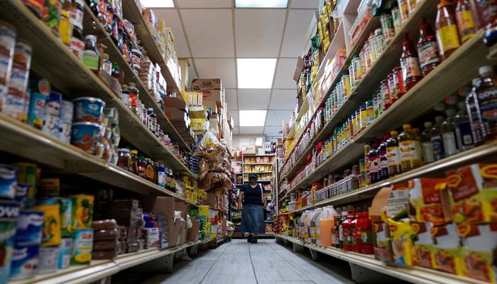 A woman shops for groceries at El Progreso Market in the Mount Pleasant neighborhood of Washington, DC, US, August 19, 2022. — Reuters