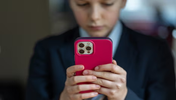 An undated image of child using iPhone. — Getty Images