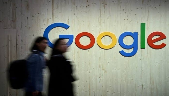 People walk past a Google logo at the Hannover Messe trade fair in Germany, April 22, 2024. — Reuters