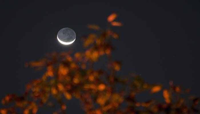 Here’s how to see tonight's partial lunar eclipse, harvest moon combo